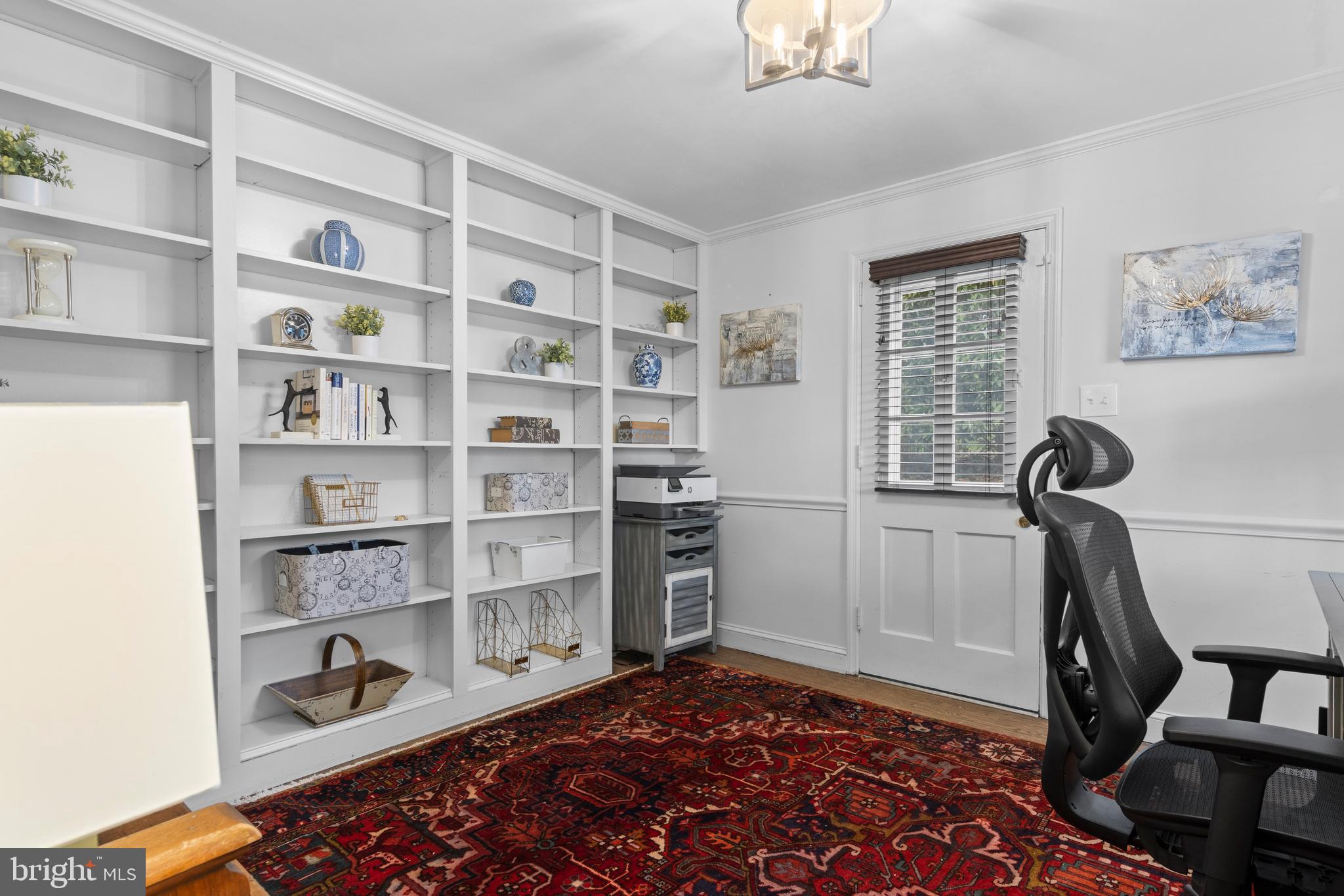 421 St Davids Road Wayne, PA 19087 - Photo 21 of 39 a room with furniture and a book shelf