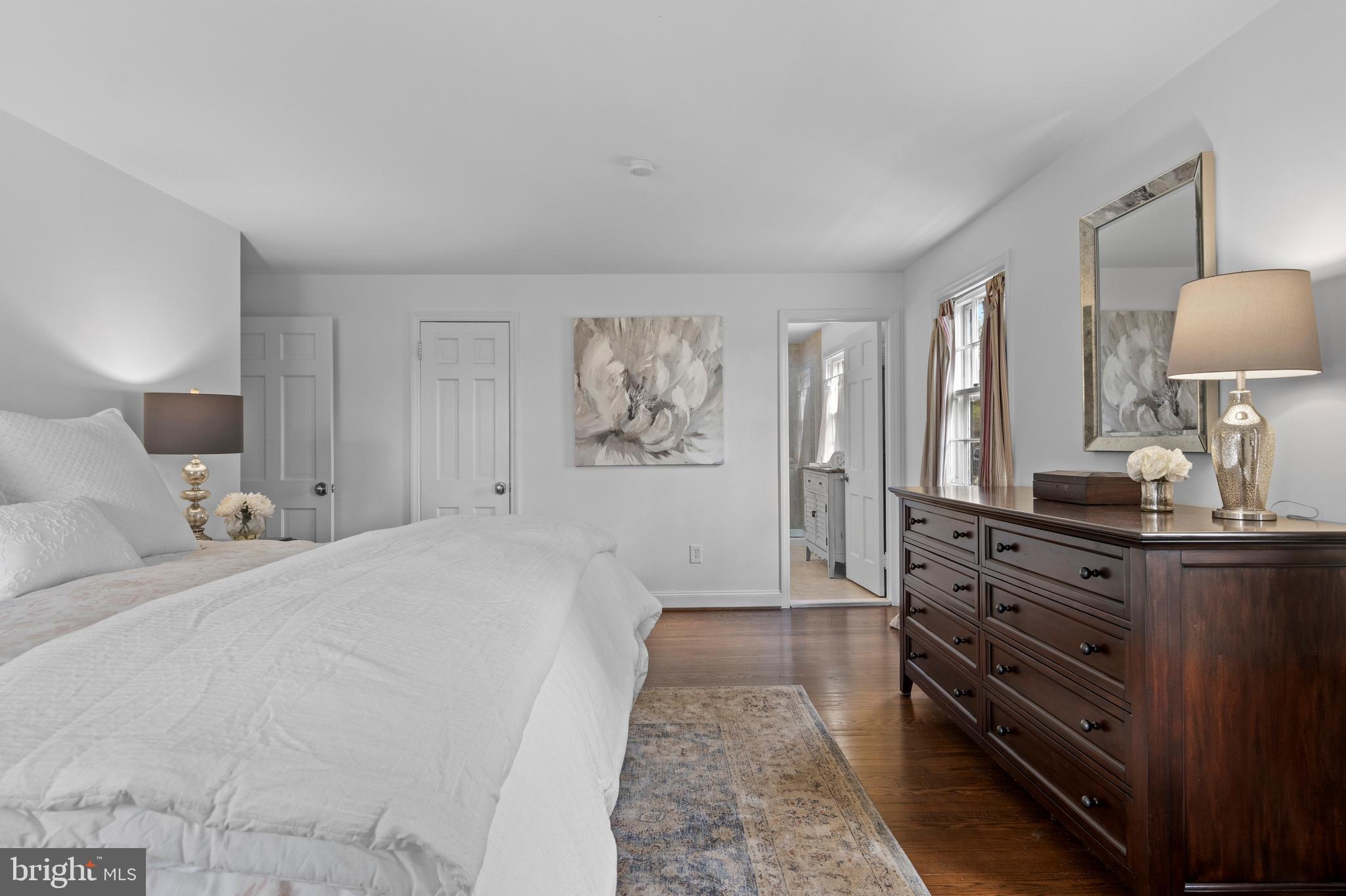 421 St Davids Road Wayne, PA 19087 - Photo 22 of 39 a bed room with a bed and a lamp