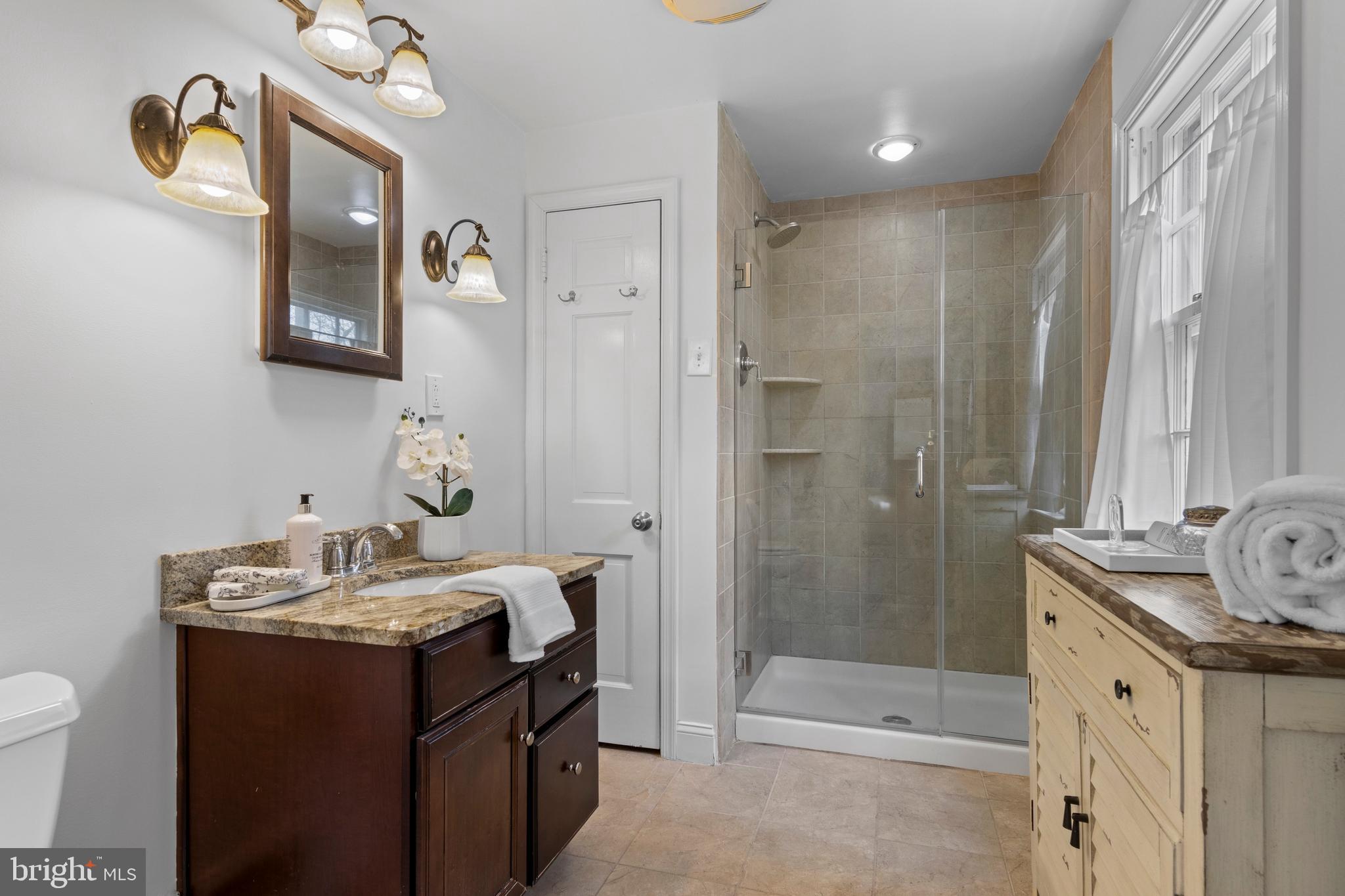 421 St Davids Road Wayne, PA 19087 - Photo 24 of 39 a bathroom with a sink and a mirror