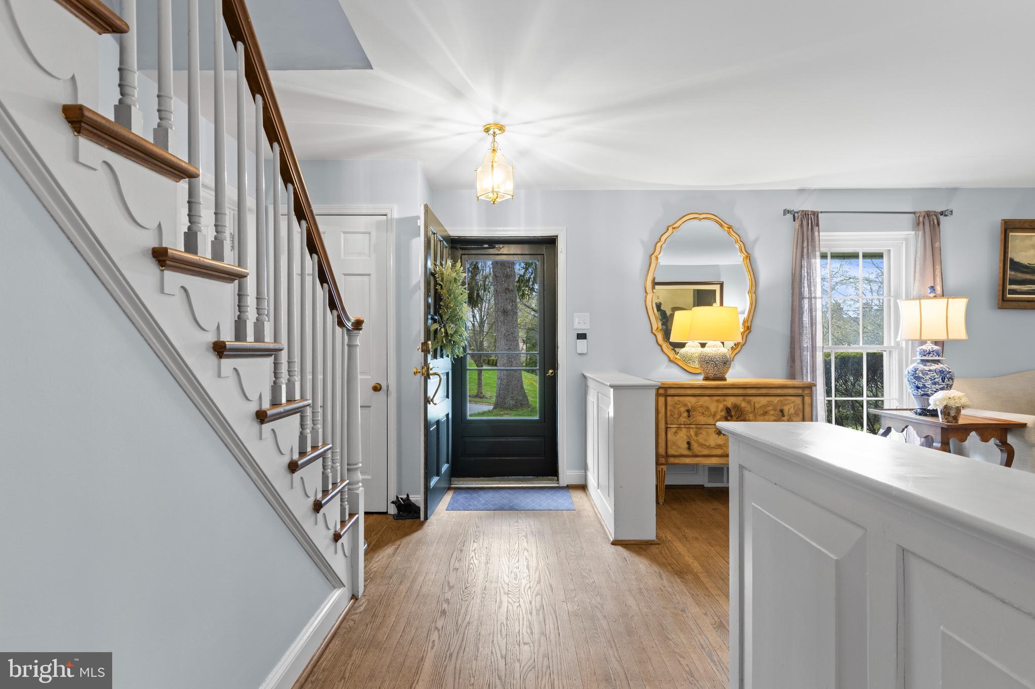 421 St Davids Road Wayne, PA 19087 - Photo 3 of 39 a view of a livingroom with wooden floor and staircase