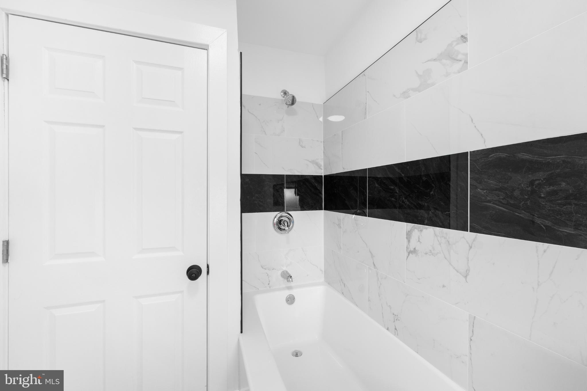 2508 East Indiana Avenue Philadelphia, PA 19134 - Photo 19 of 37 a bathroom with a bathtub and shower