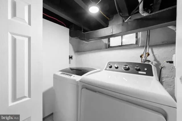 a bathroom with a toilet sink and shower
