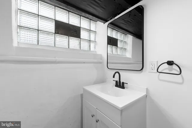 a view of house with a deck and furniture