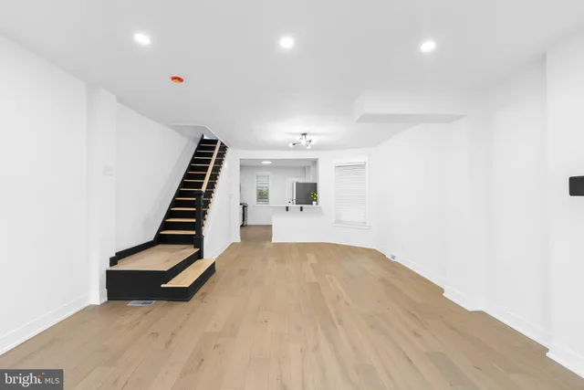 a view of an empty room with stairs