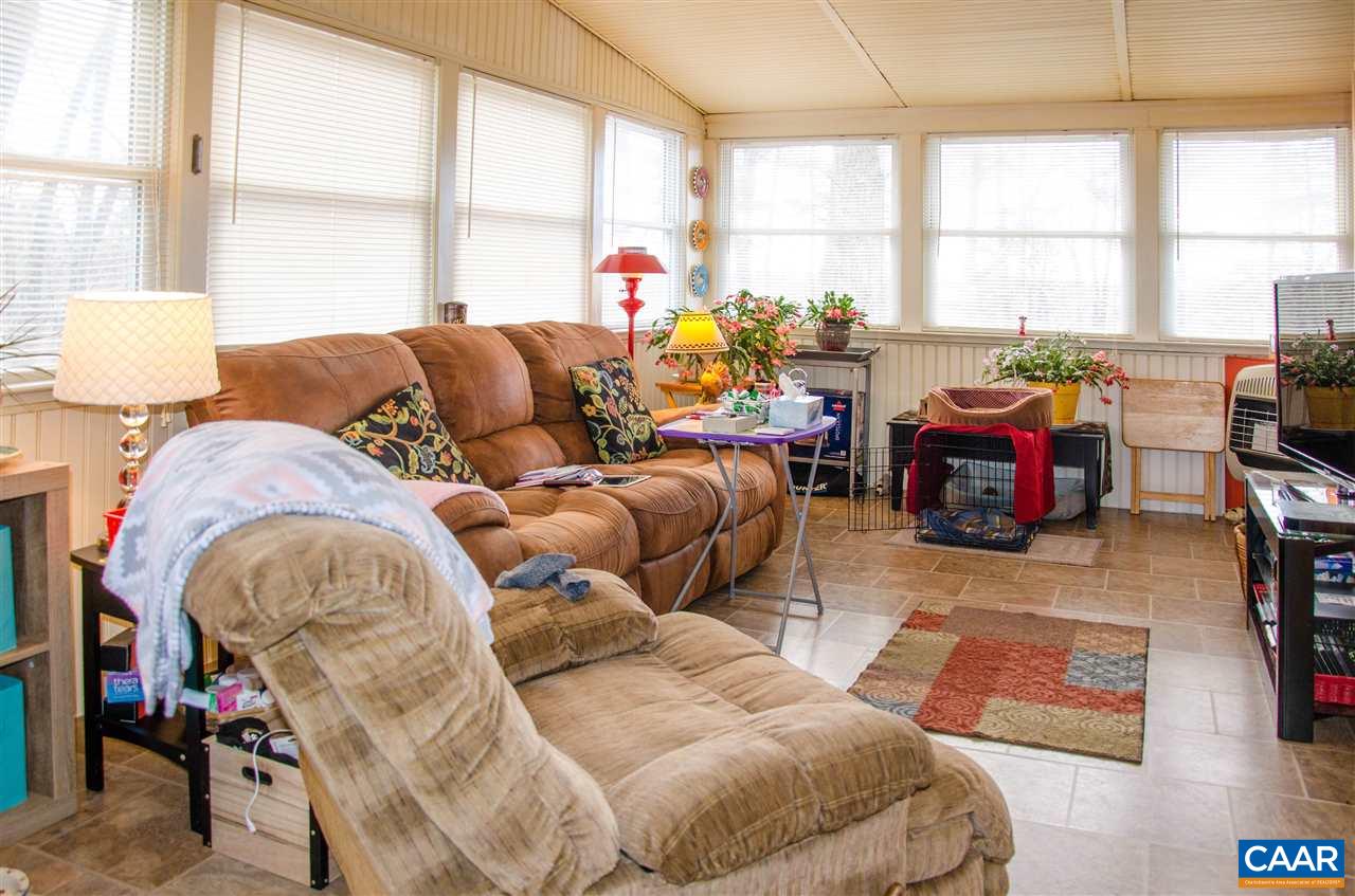 3919 Firehouse Road Howardsville, VA 24562 - Photo 20 of 49 a living room filled with furniture and a large window