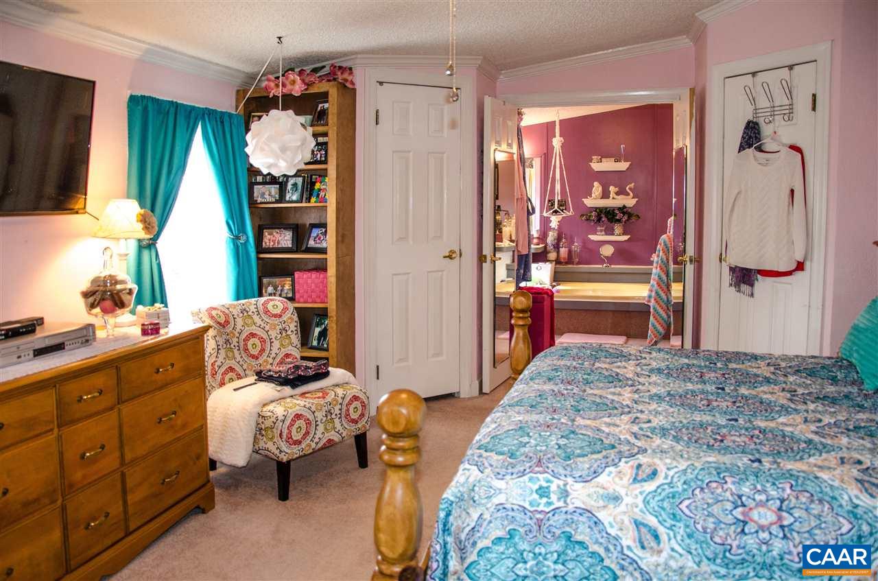 3919 Firehouse Road Howardsville, VA 24562 - Photo 26 of 49 a bedroom with furniture and a wooden floor