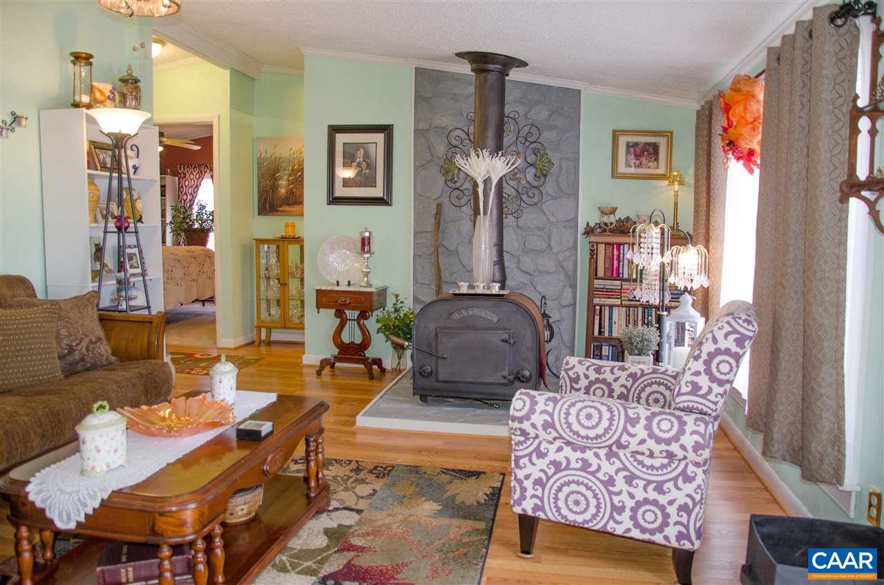 3919 Firehouse Road Howardsville, VA 24562 - Photo 30 of 49 a living room with furniture and a window