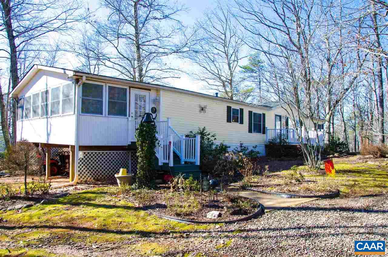 3919 Firehouse Road Howardsville, VA 24562 - Photo 3 of 49 a front view of a house with garden
