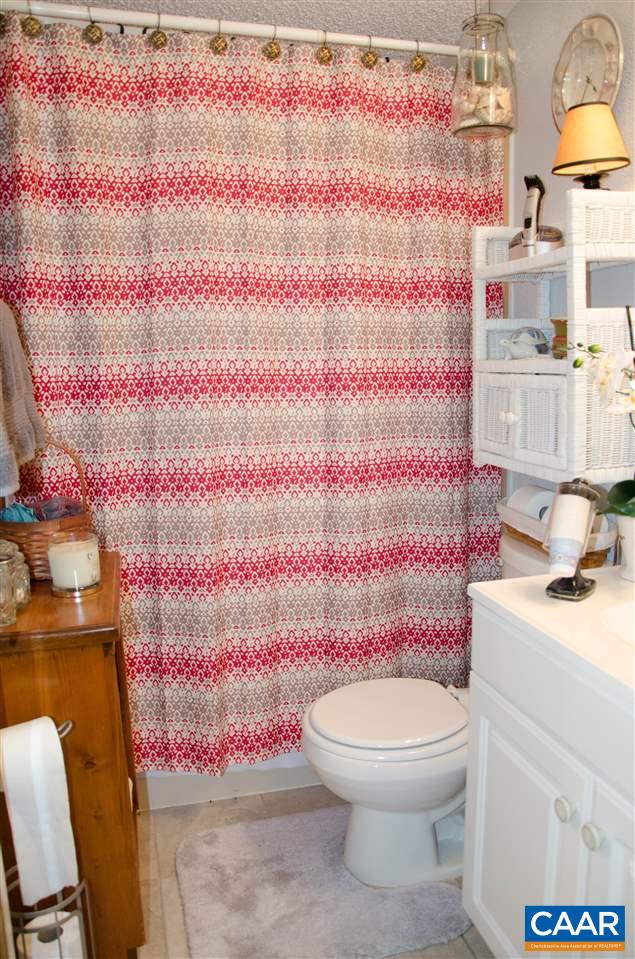 3919 Firehouse Road Howardsville, VA 24562 - Photo 33 of 49 a white toilet sitting next to a bathroom sink