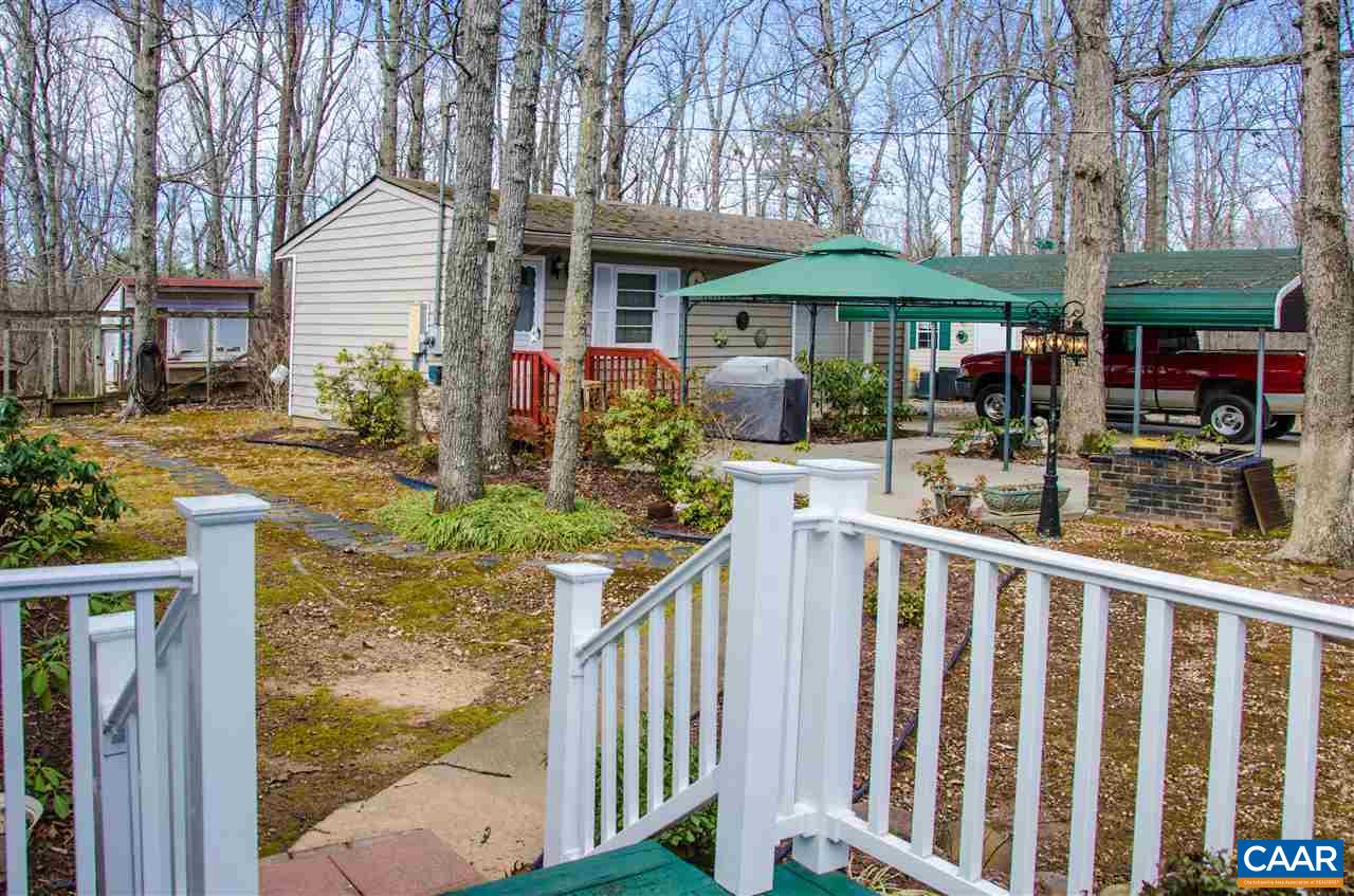 3919 Firehouse Road Howardsville, VA 24562 - Photo 43 of 49 a view of a house with backyard and sitting area