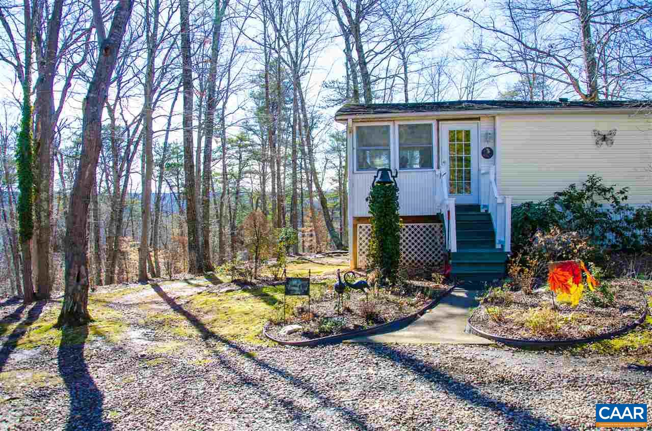 3919 Firehouse Road Howardsville, VA 24562 - Photo 46 of 49 a view of a house with backyard and sitting area