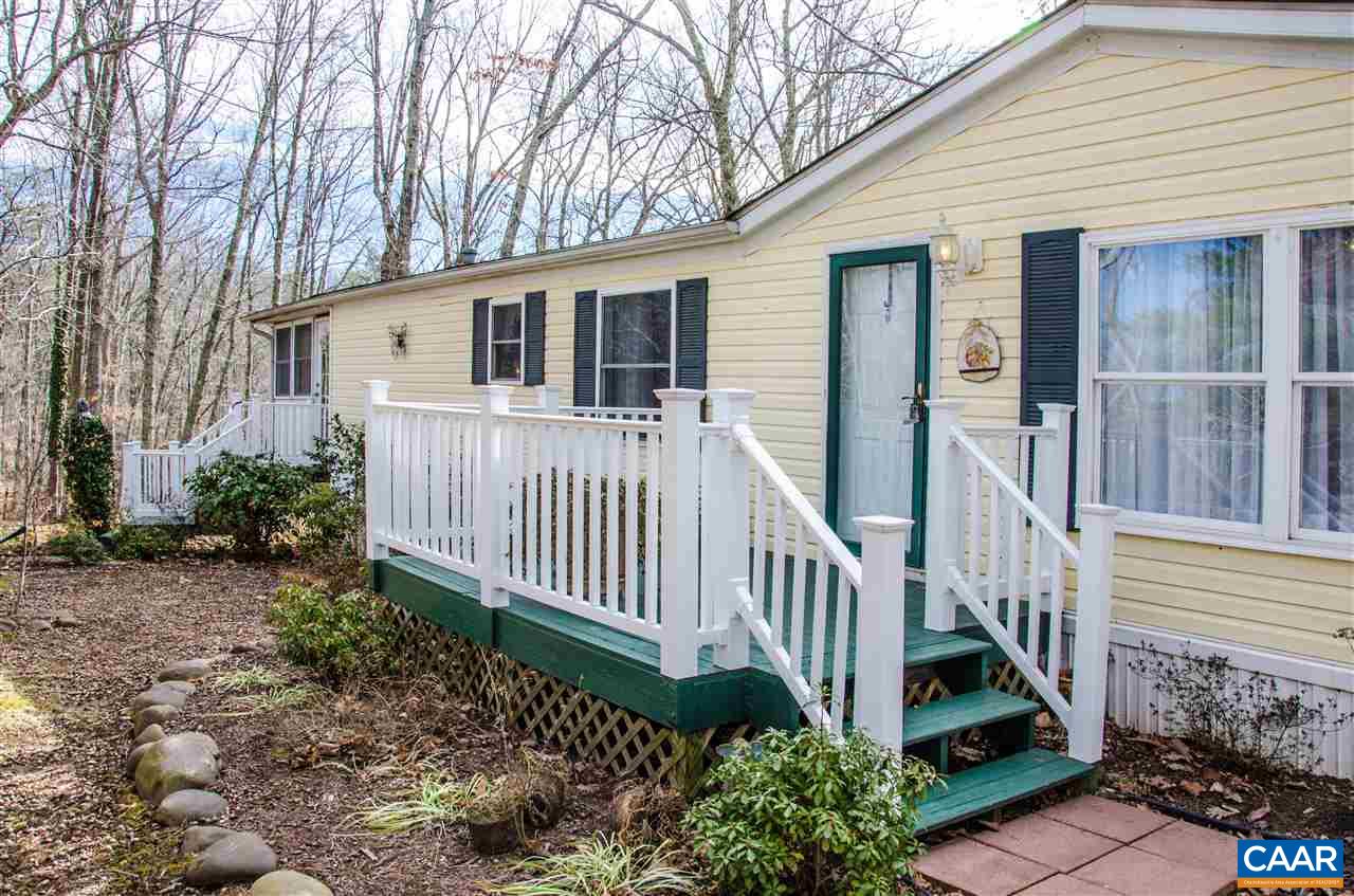 3919 Firehouse Road Howardsville, VA 24562 - Photo 5 of 49 a view of a house with wooden fence next to a yard