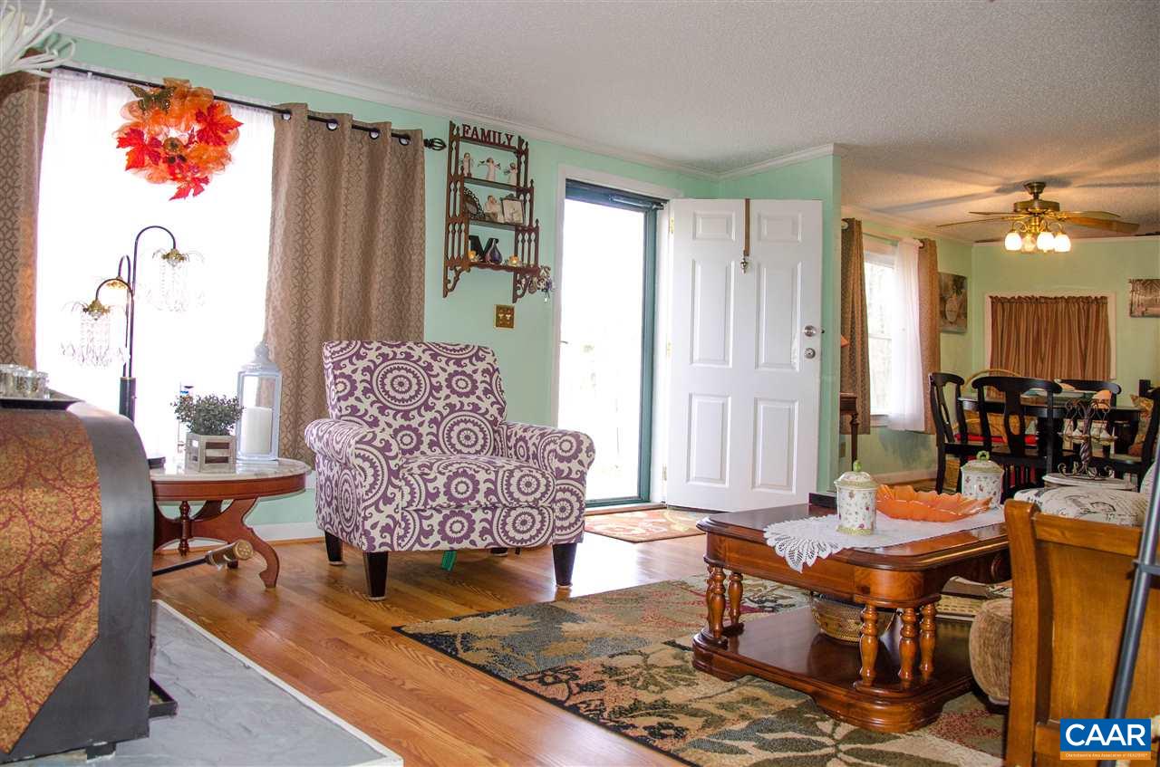 3919 Firehouse Road Howardsville, VA 24562 - Photo 7 of 49 a living room with furniture and a window