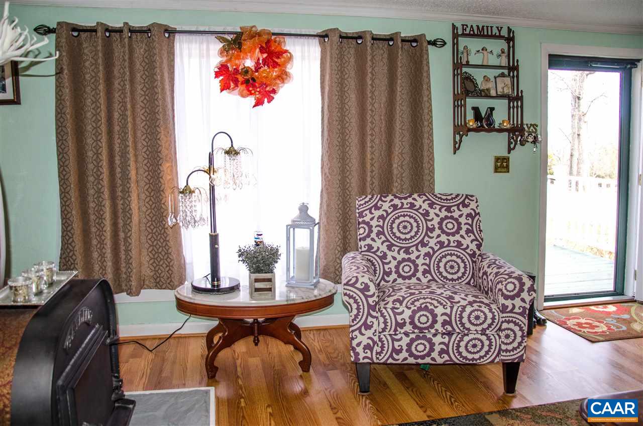 3919 Firehouse Road Howardsville, VA 24562 - Photo 8 of 49 a view of a dining room with furniture and a window
