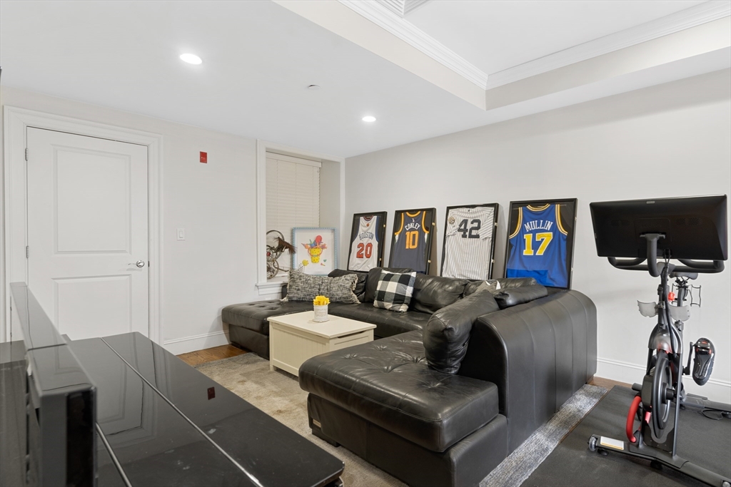 1471 Beacon Street, Unit 1 Brookline, MA 02446 - Photo 14 of 20 a living room with furniture and a flat screen tv