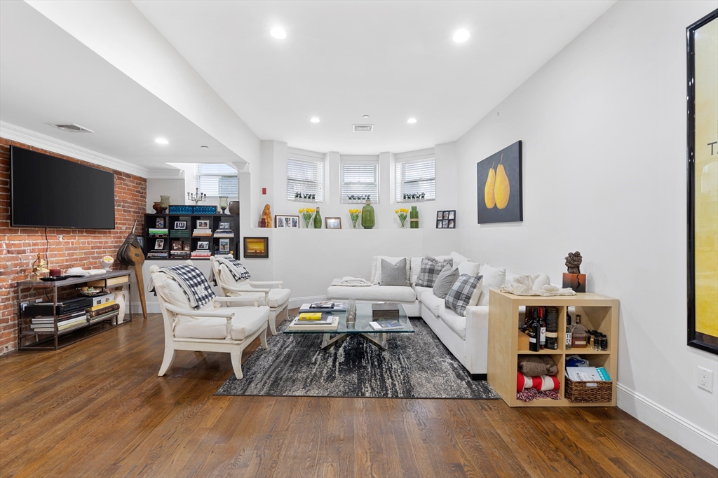1471 Beacon Street, Unit 1 Brookline, MA 02446 - Photo 5 of 20 a living room with furniture and a flat screen tv