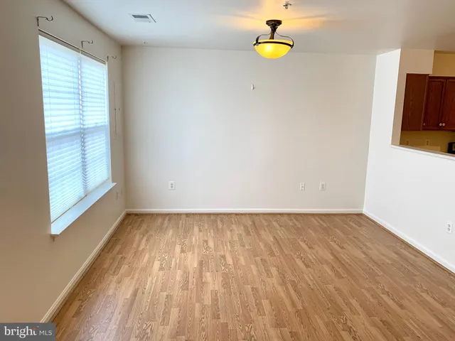 a view of a room with wooden floor and blue walls