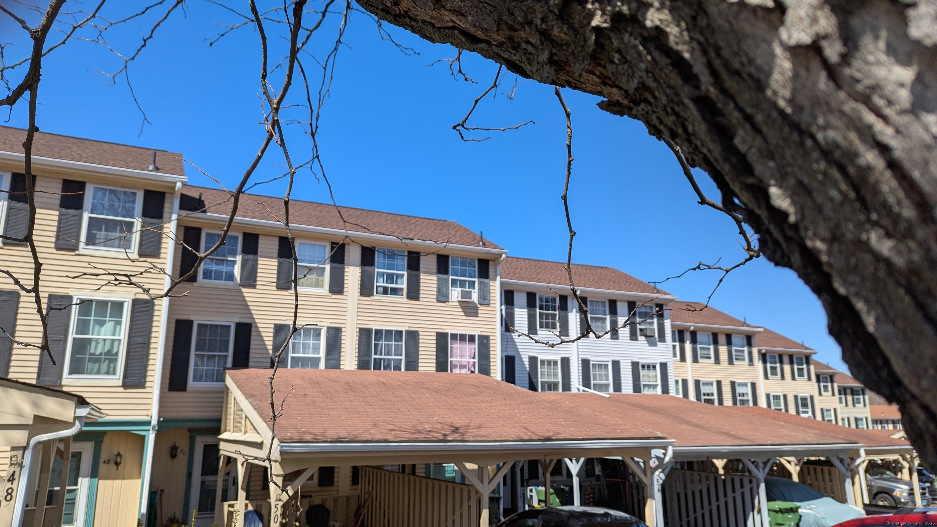 a front view of a building with a garden