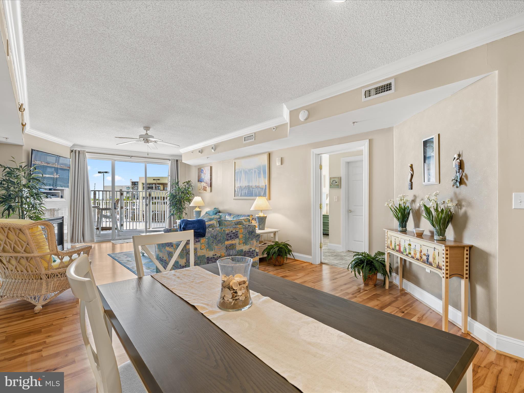 11900 Coastal Highway, Unit 102 Ocean City, MD 21842 - Photo 39 of 39 a living room with furniture wooden floor and a large window