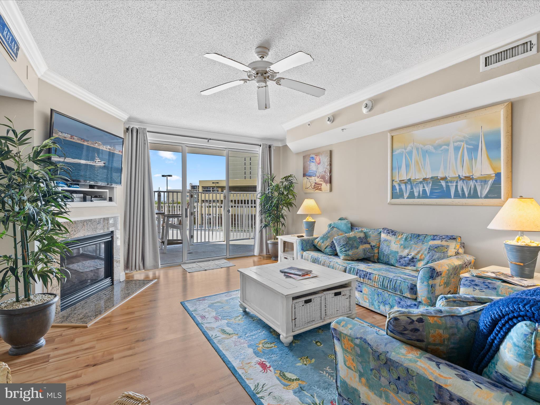 11900 Coastal Highway, Unit 102 Ocean City, MD 21842 - Photo 14 of 39 a living room with furniture and a potted plant
