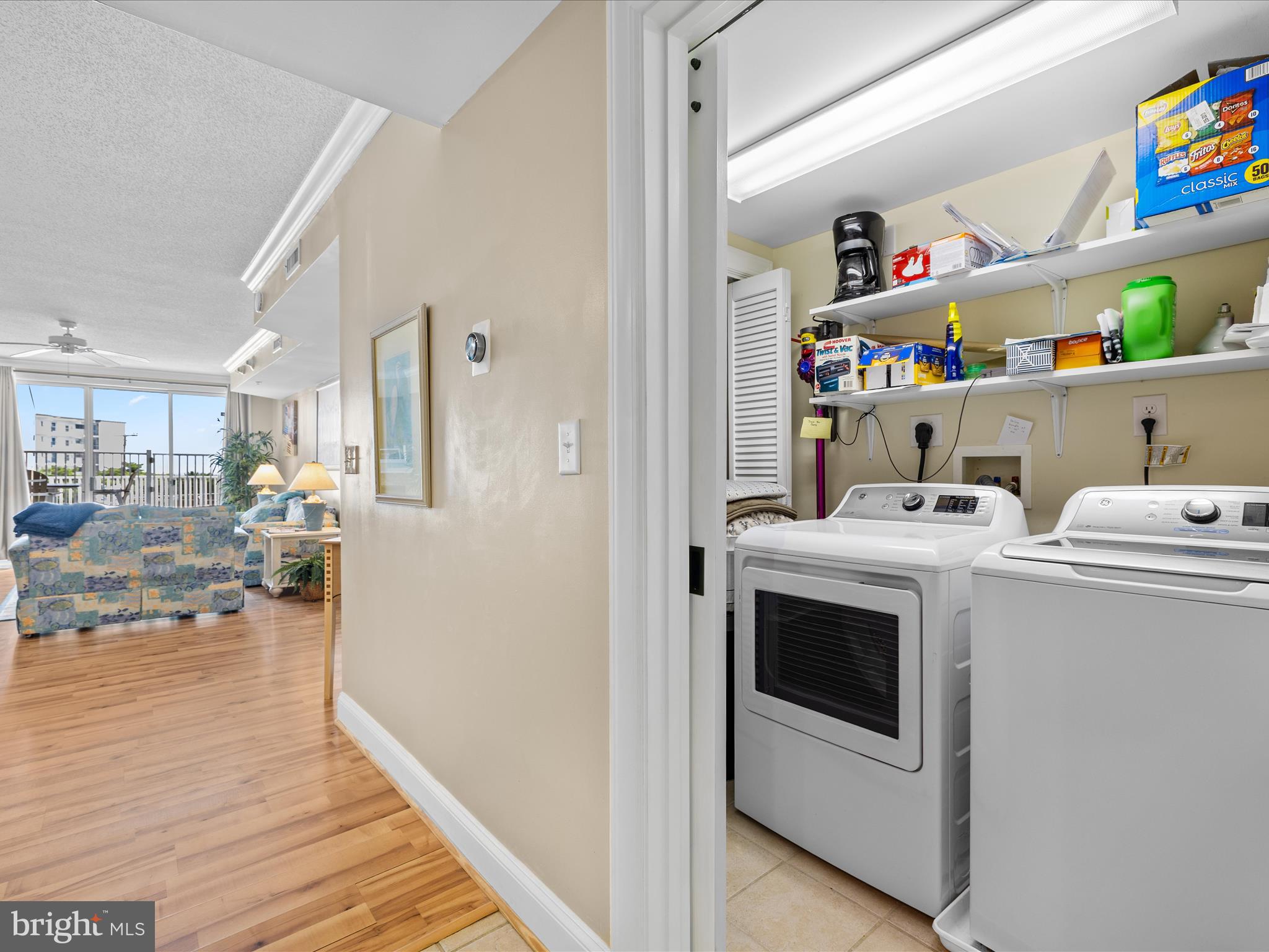 11900 Coastal Highway, Unit 102 Ocean City, MD 21842 - Photo 16 of 39 a view of living room with washer and dryer