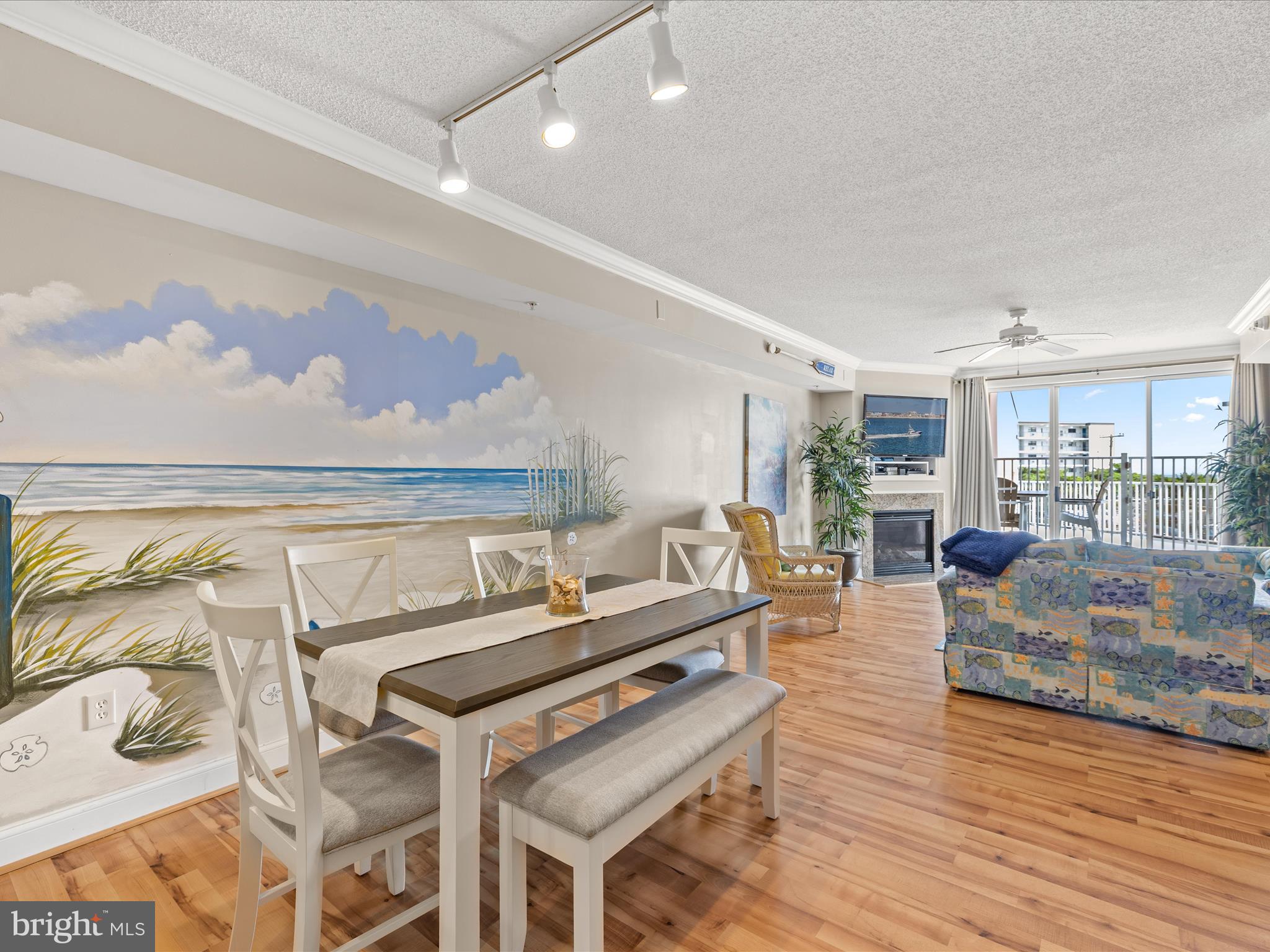 11900 Coastal Highway, Unit 102 Ocean City, MD 21842 - Photo 10 of 39 a living room with furniture and a wooden floor