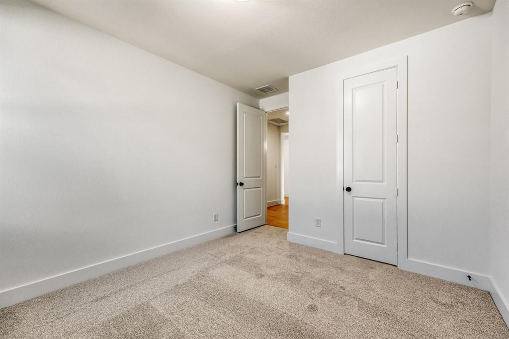 147 Derrett Lane Rhome, TX 76078 - Photo 21 of 28 Unfurnished bedroom with light carpet and baseboards