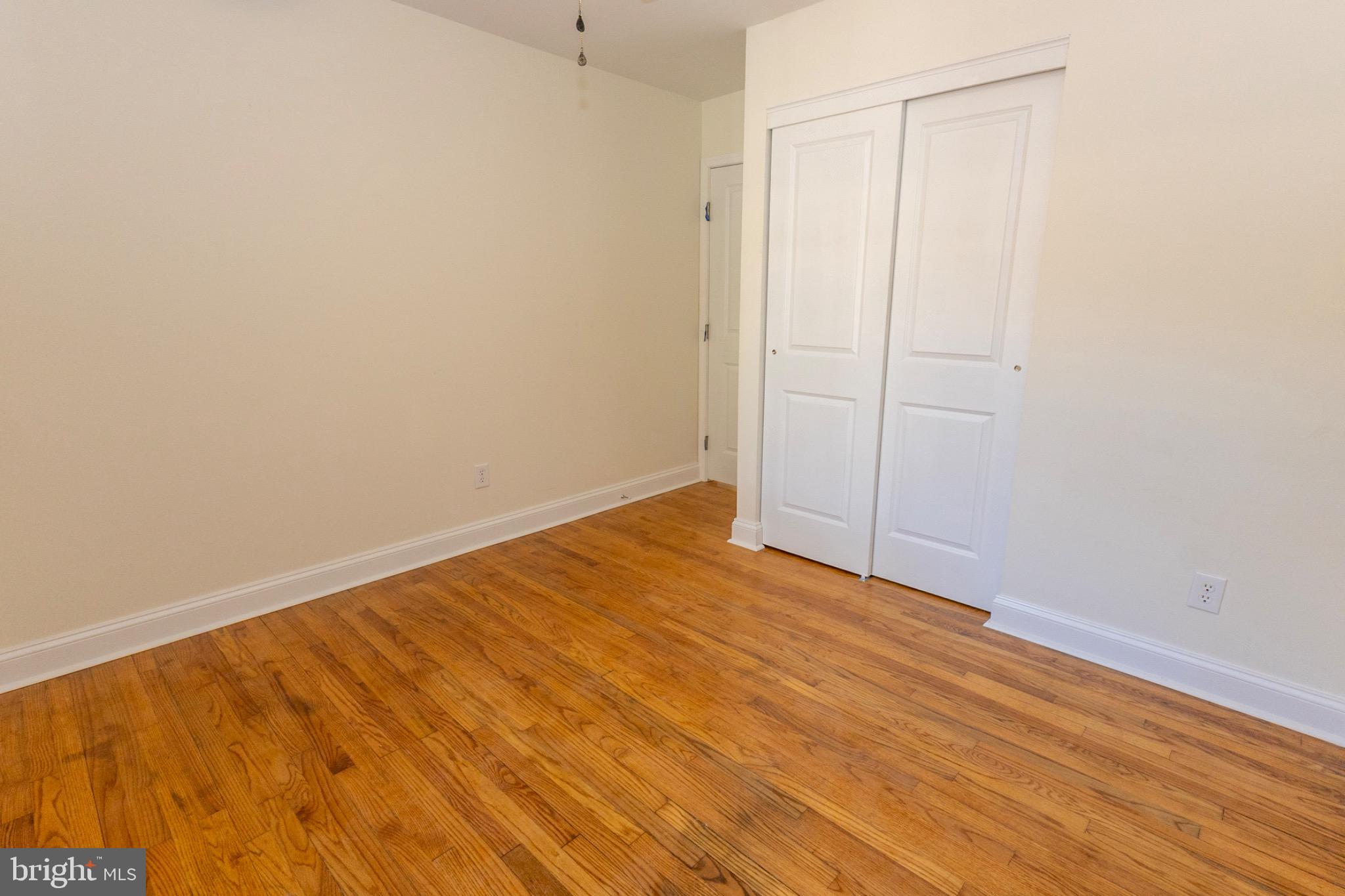 49151 Wynne Road Ridge, MD 20680 - Photo 33 of 80 Bright and airy bedroom with warm wood floors.