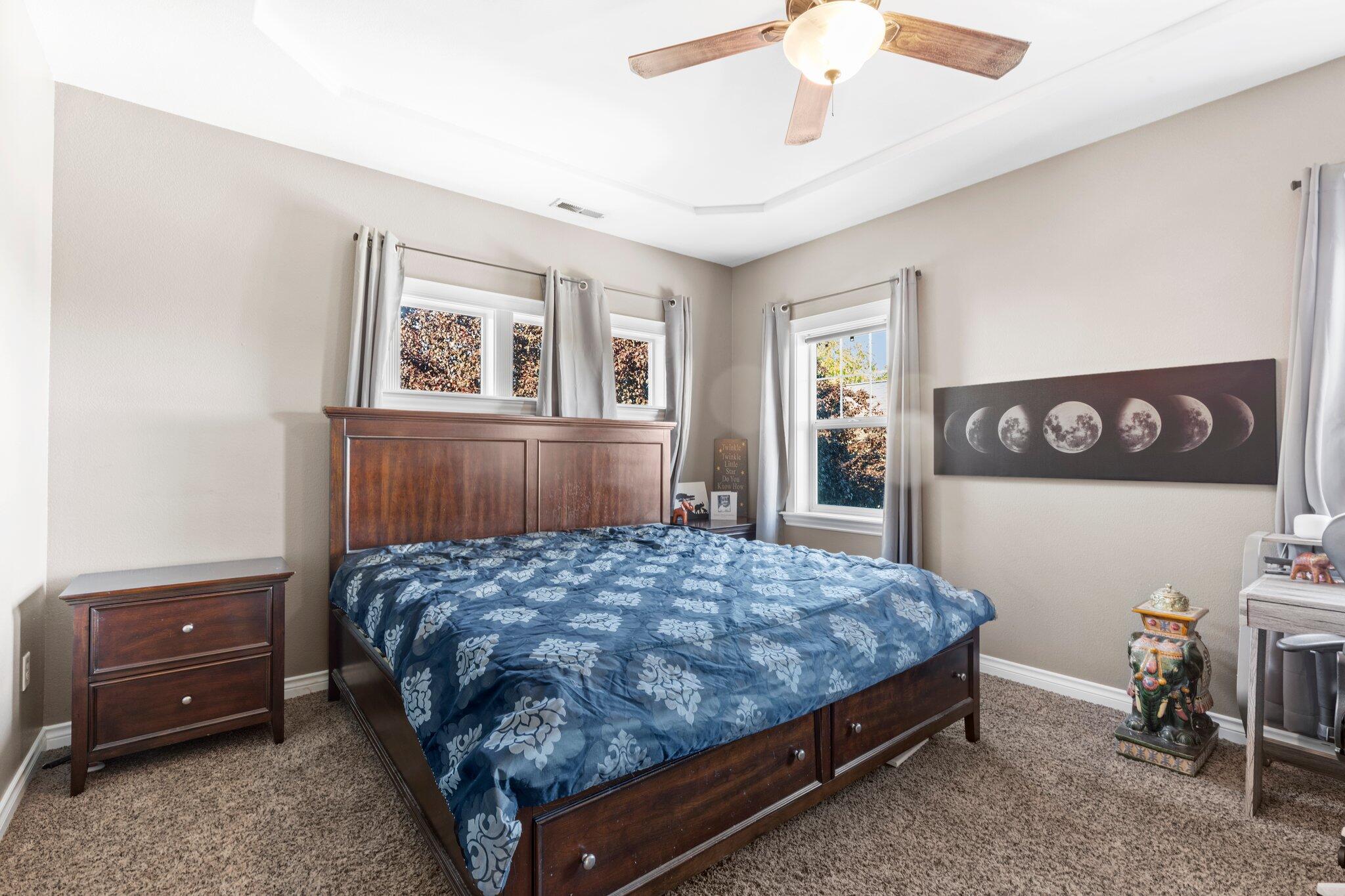 878 Ridgeview Drive Eagle Point, OR 97524 - Photo 22 of 39 a bedroom with a bed and a dresser in it