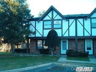 1 C Jamestown Court Ridge, NY 11961 - Photo 1 of 1 front view of a house with a yard