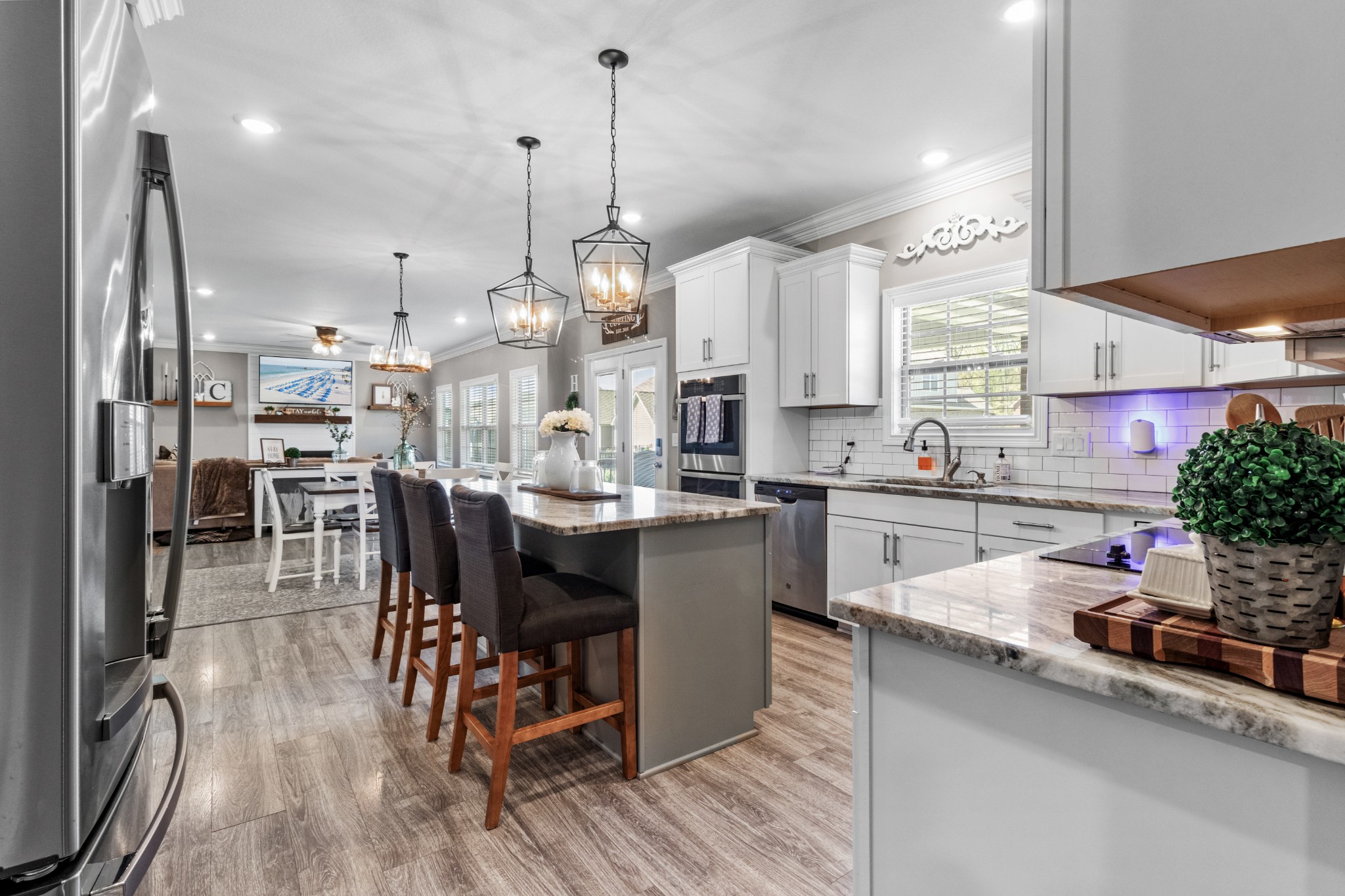 532 Bowden Drive Clarksville, TN 37043 - Photo 11 of 47 a kitchen with stainless steel appliances kitchen island granite countertop a sink table and chairs