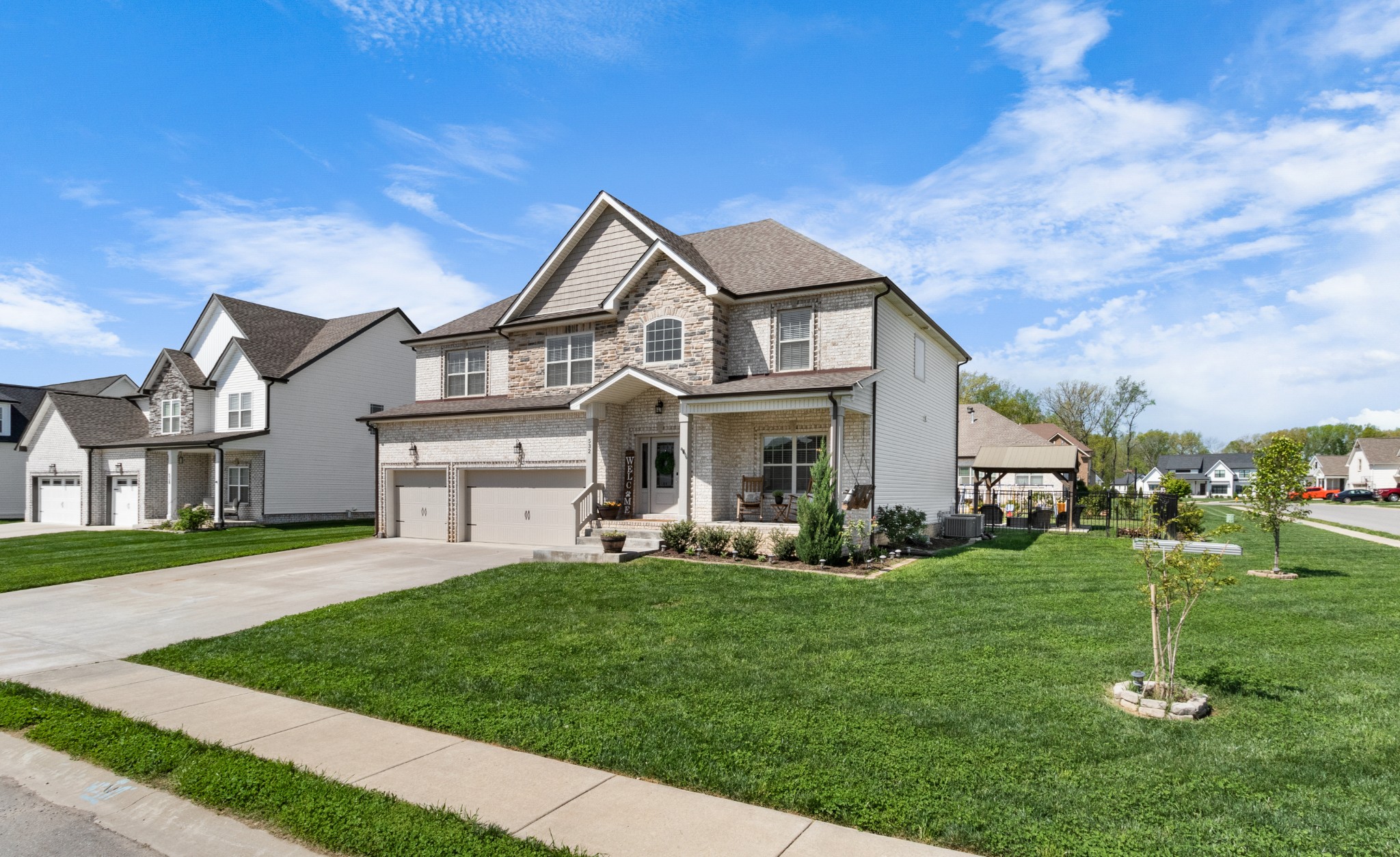 532 Bowden Drive Clarksville, TN 37043 - Photo 3 of 47 a front view of a house with a garden and trees