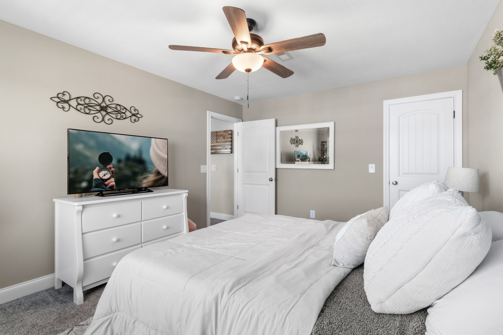 532 Bowden Drive Clarksville, TN 37043 - Photo 37 of 47 a bedroom with a large bed and a chandelier