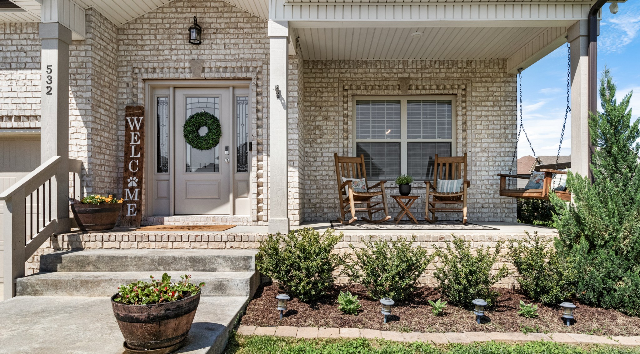 532 Bowden Drive Clarksville, TN 37043 - Photo 4 of 47 a view of a house with potted plants and a fountain