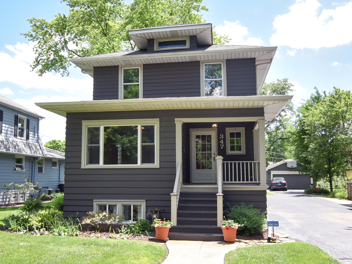 347 Herrick Road Riverside, IL 60546 - Photo 1 of 28 a front view of a house with garden