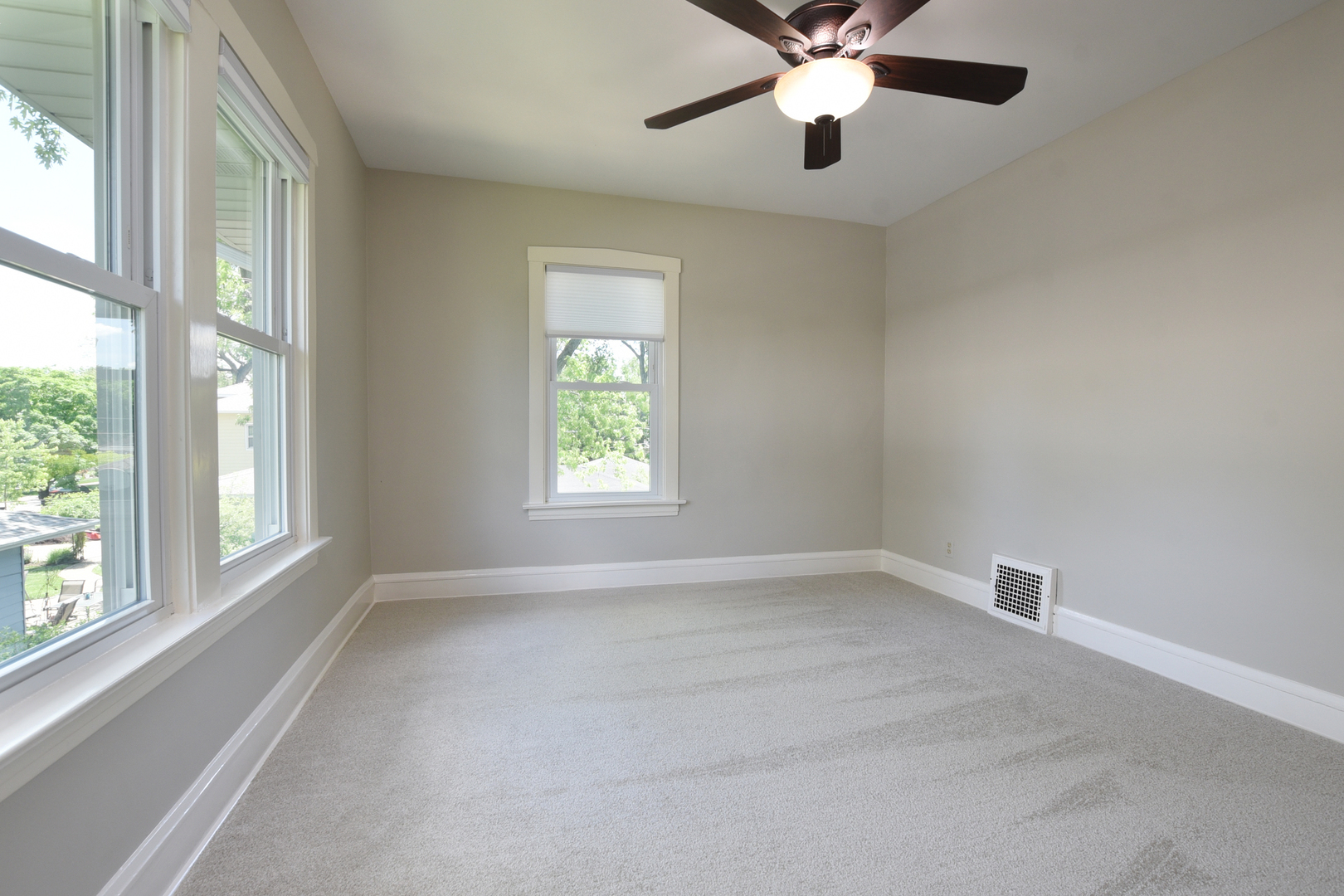 347 Herrick Road Riverside, IL 60546 - Photo 13 of 28 an empty room with windows and fan