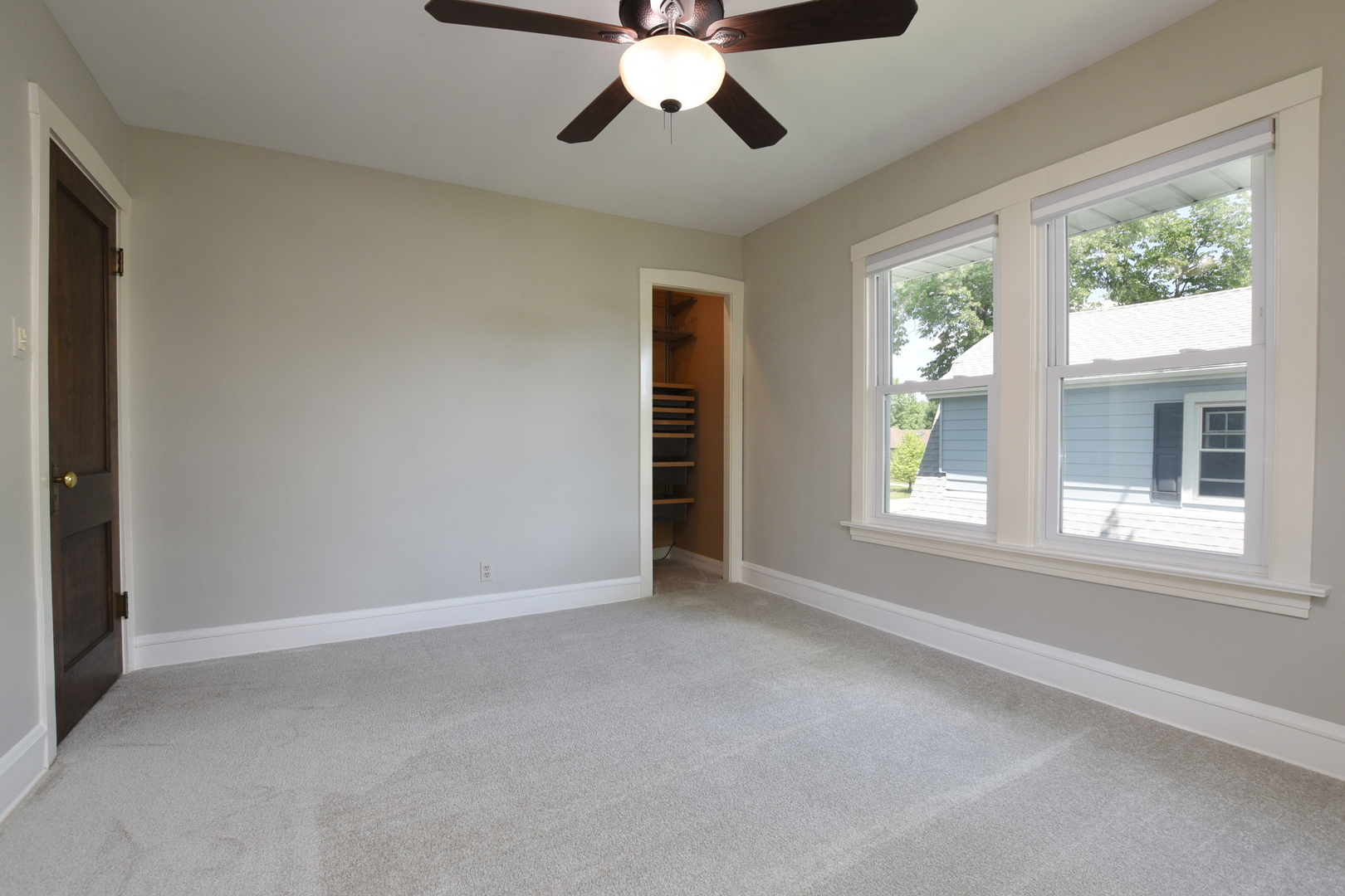 347 Herrick Road Riverside, IL 60546 - Photo 16 of 28 an empty room with chandelier fan and windows