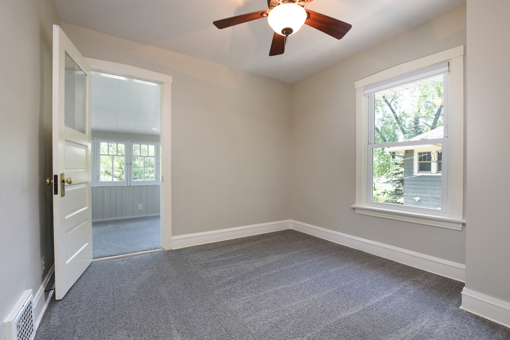 347 Herrick Road Riverside, IL 60546 - Photo 18 of 28 an empty room with a window and a kitchen