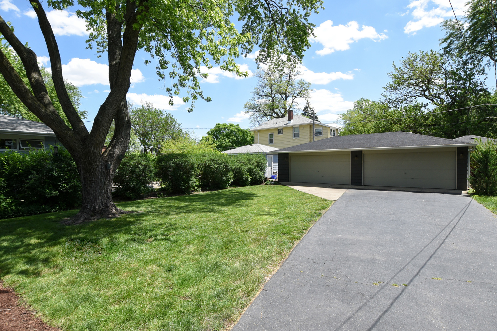 347 Herrick Road Riverside, IL 60546 - Photo 24 of 28 a front view of a house with garden and yard