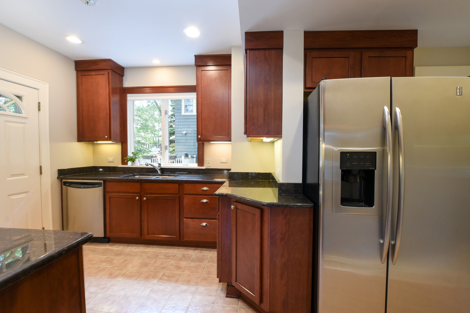 347 Herrick Road Riverside, IL 60546 - Photo 7 of 28 a kitchen with stainless steel appliances granite countertop a refrigerator and a sink