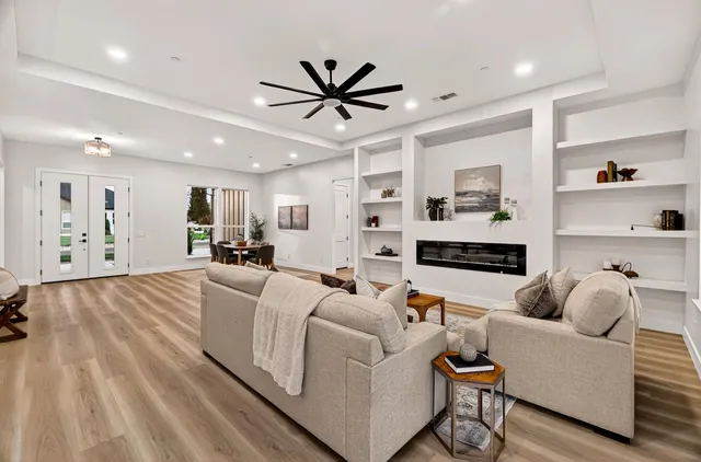 a kitchen with stainless steel appliances granite countertop a sink and cabinets