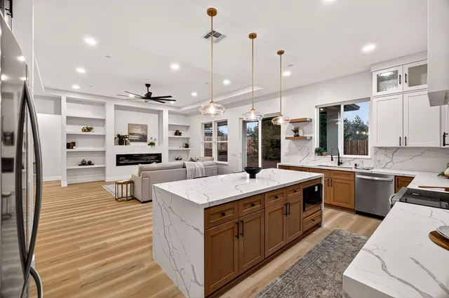 a dining room with furniture and wooden floor