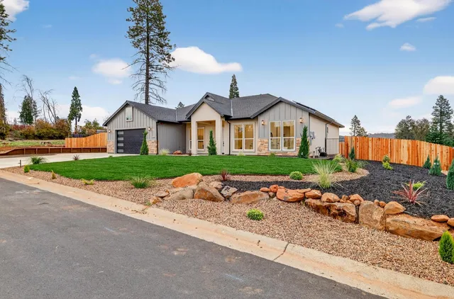 a view of a livingroom with furniture wooden floor and entryway