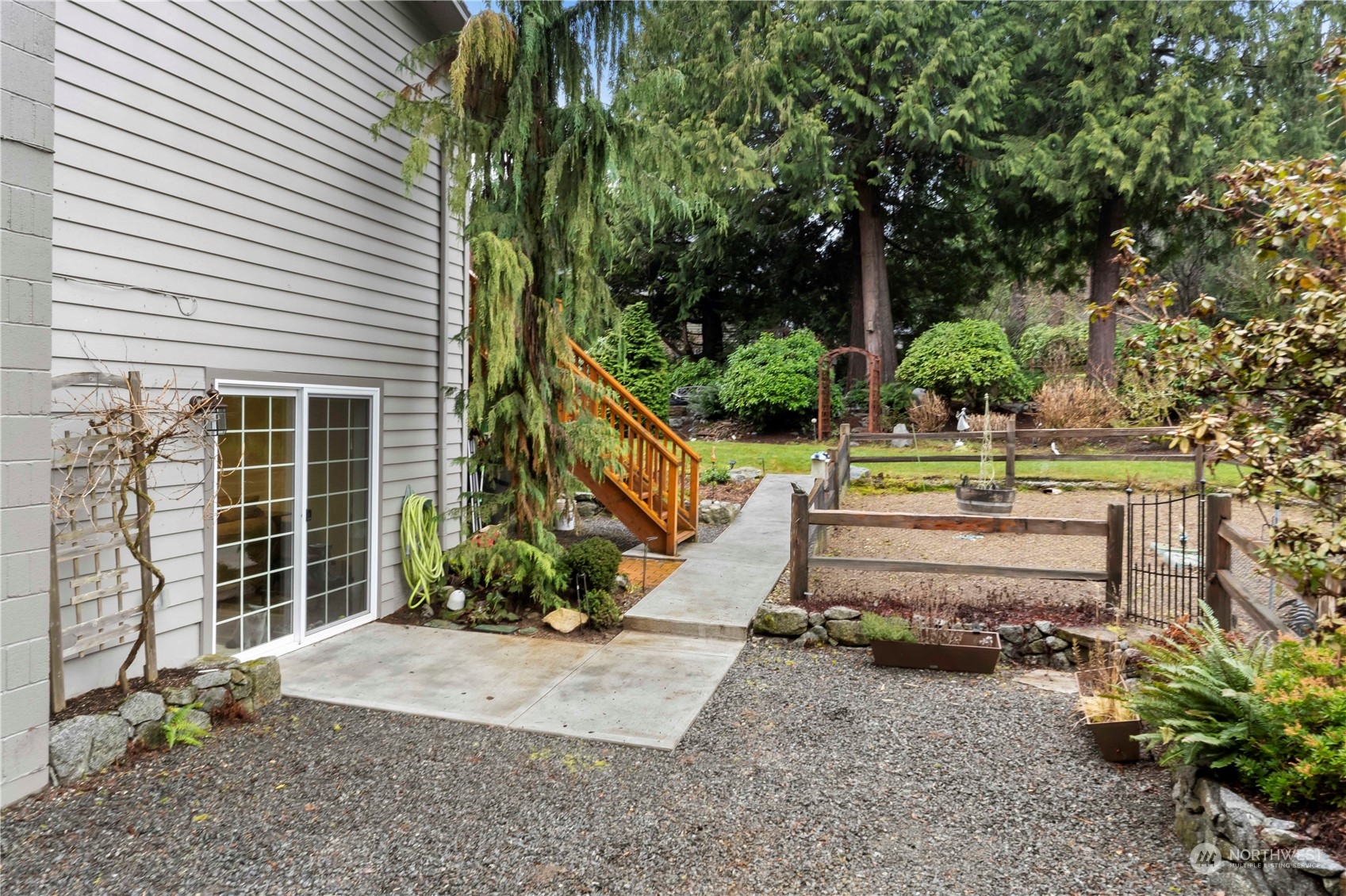 4906 200th Street Southeast Bothell, WA 98012 - Photo 11 of 40 a front view of a house with a garden