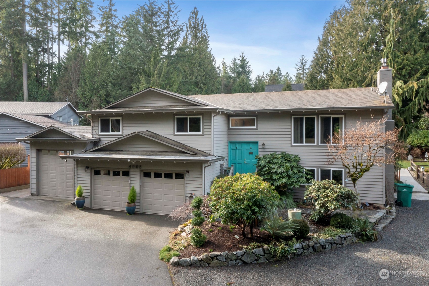 4906 200th Street Southeast Bothell, WA 98012 - Photo 2 of 40 a front view of a house with a garden