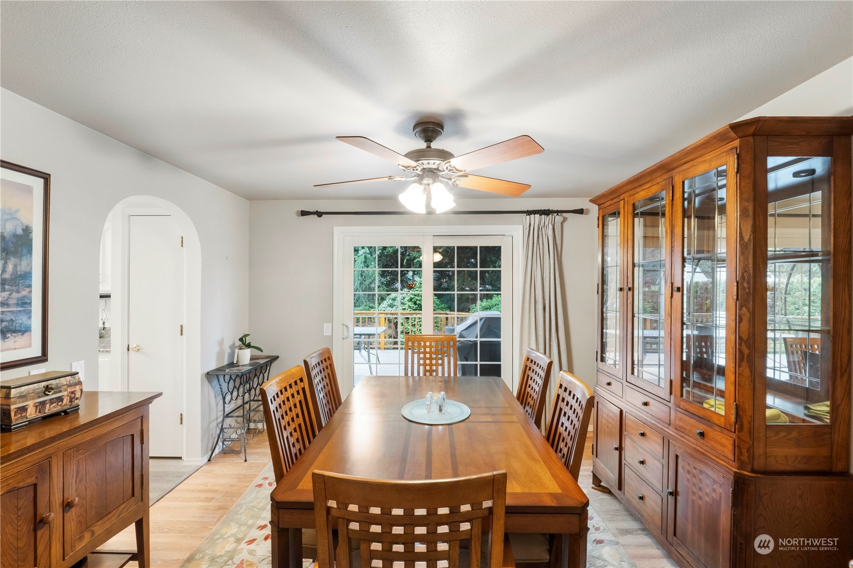 4906 200th Street Southeast Bothell, WA 98012 - Photo 22 of 40 a dining room with furniture a chandelier and wooden floor