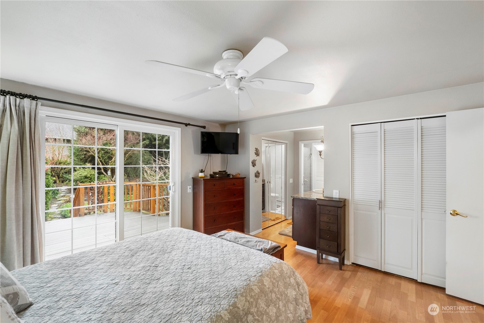 4906 200th Street Southeast Bothell, WA 98012 - Photo 24 of 40 a bedroom with a bed and wooden floor