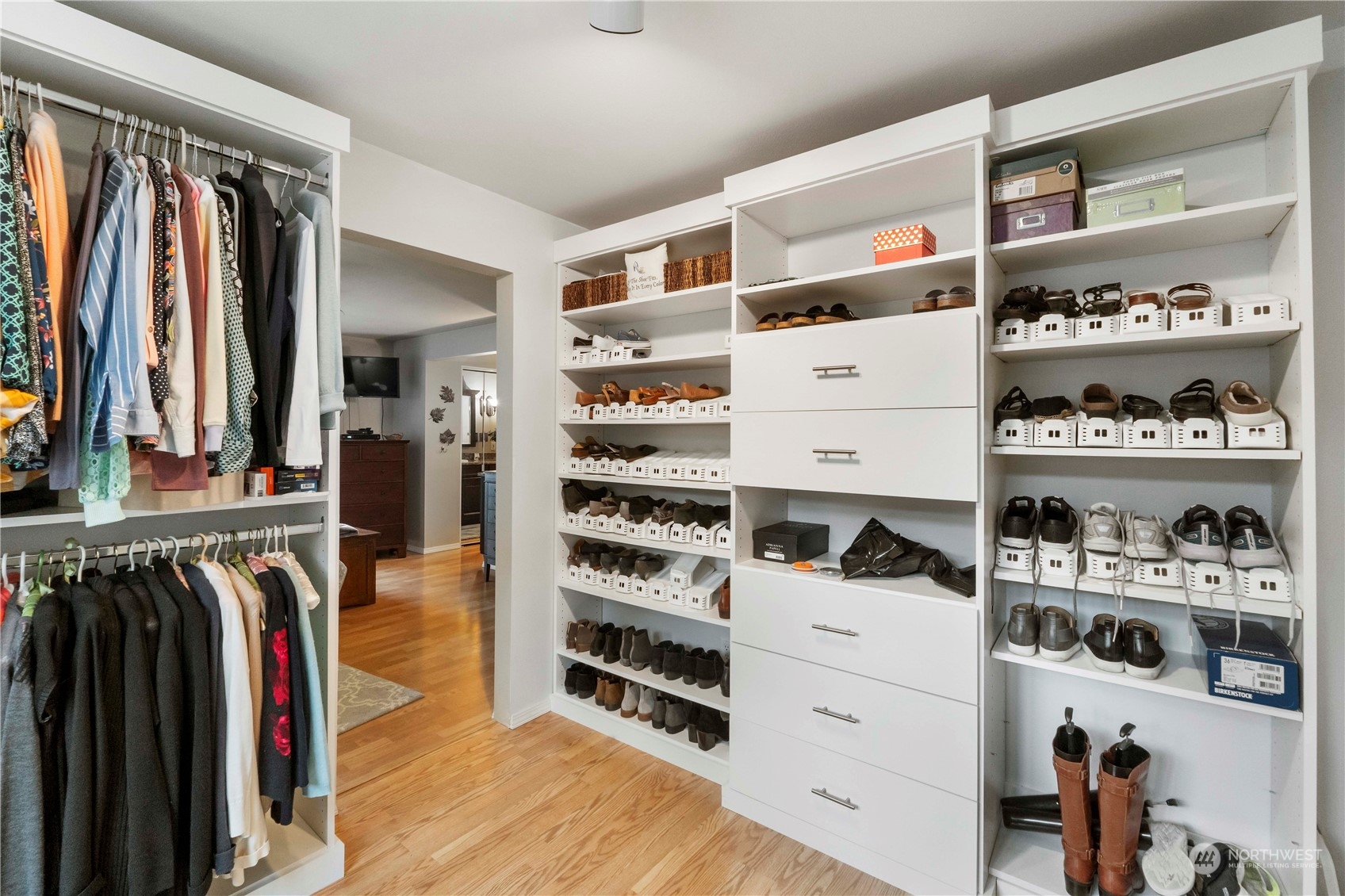 4906 200th Street Southeast Bothell, WA 98012 - Photo 27 of 40 a view of walk in closet with clothes and shoes