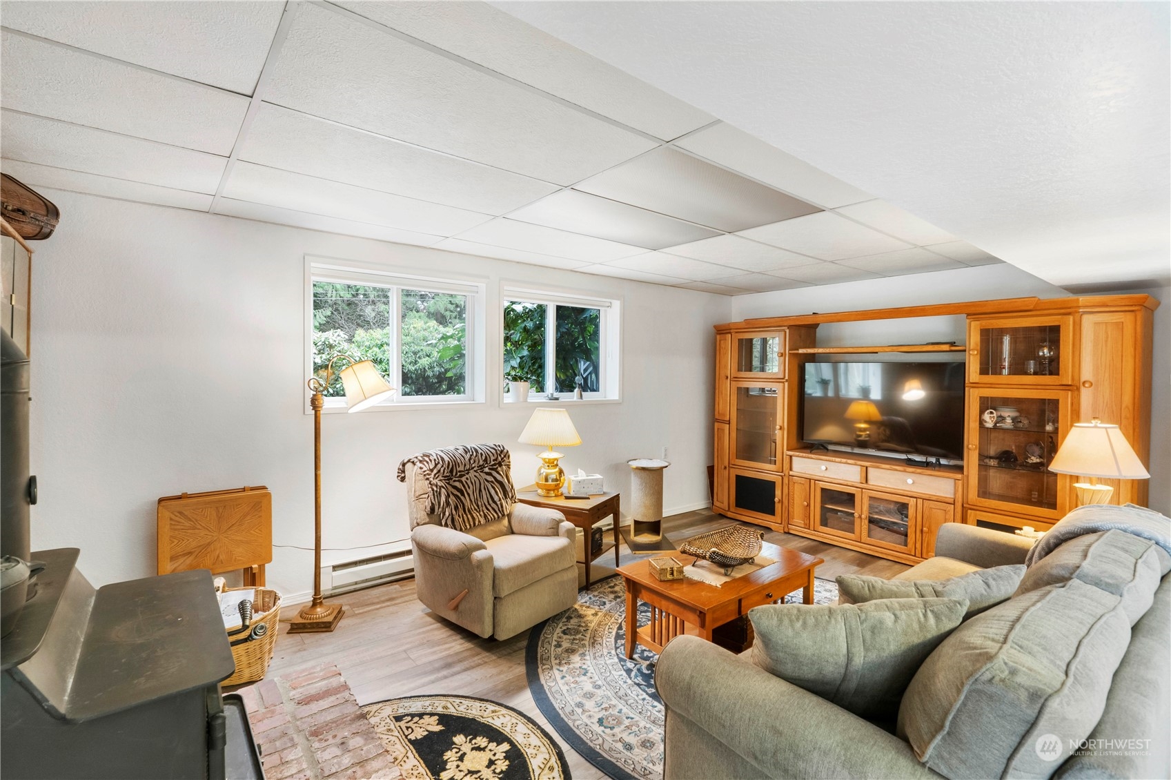 4906 200th Street Southeast Bothell, WA 98012 - Photo 32 of 40 a living room with furniture and a flat screen tv