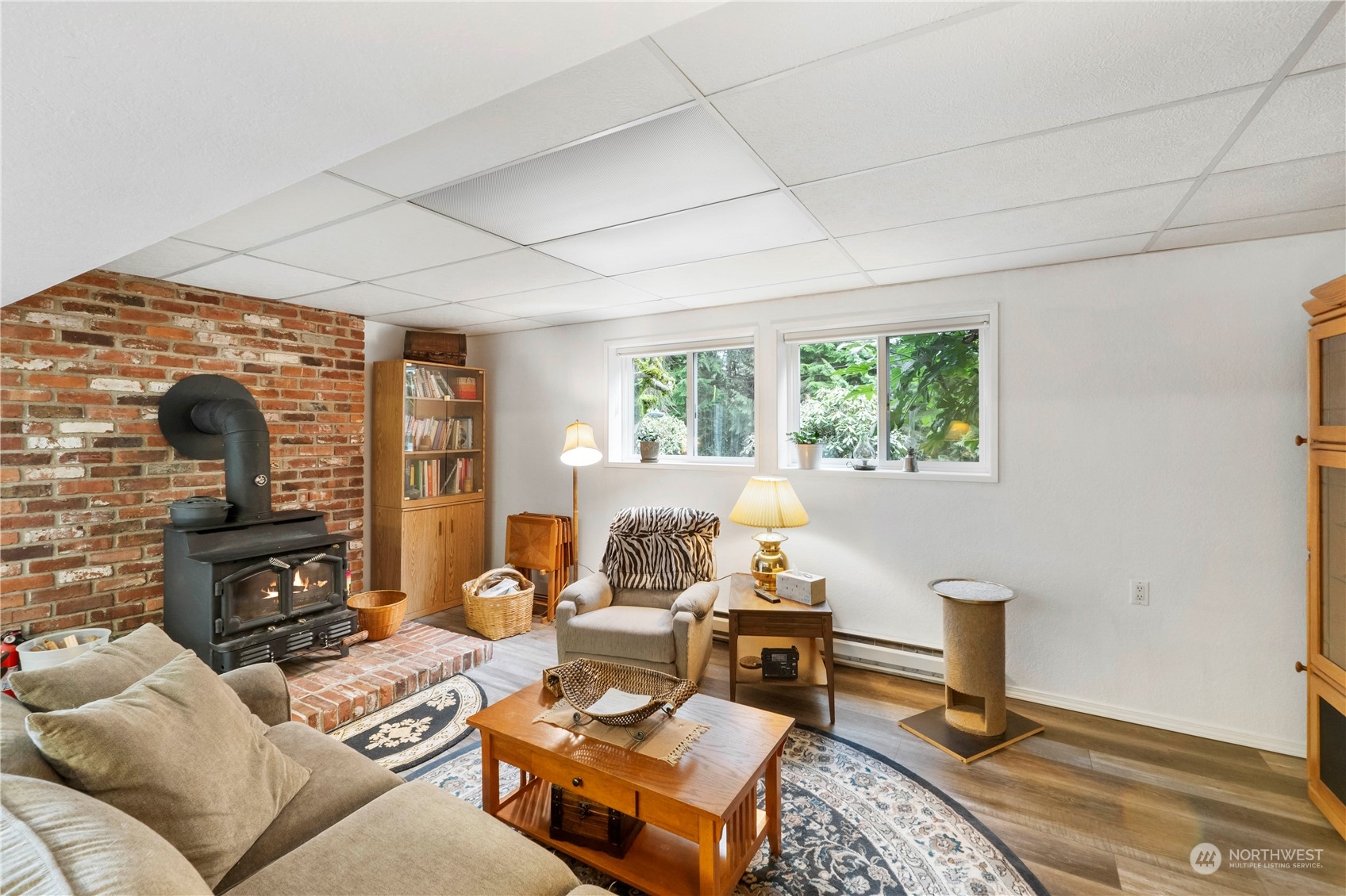 4906 200th Street Southeast Bothell, WA 98012 - Photo 33 of 40 a living room with furniture and a fireplace